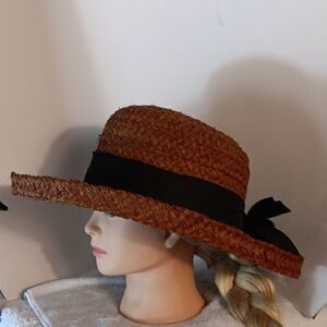 Elegant Brown Straw Hat with Black Ribbon
